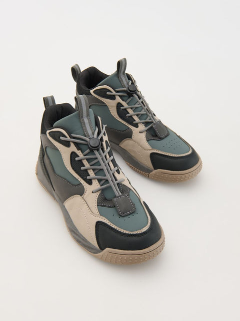 Pair of high-top sneakers with a mix of gray, black, and beige colors on a light gray background.
