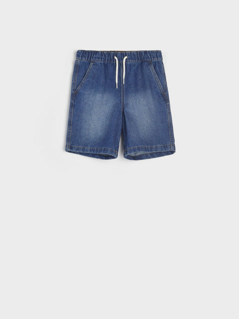 Blue denim shorts on a white background
