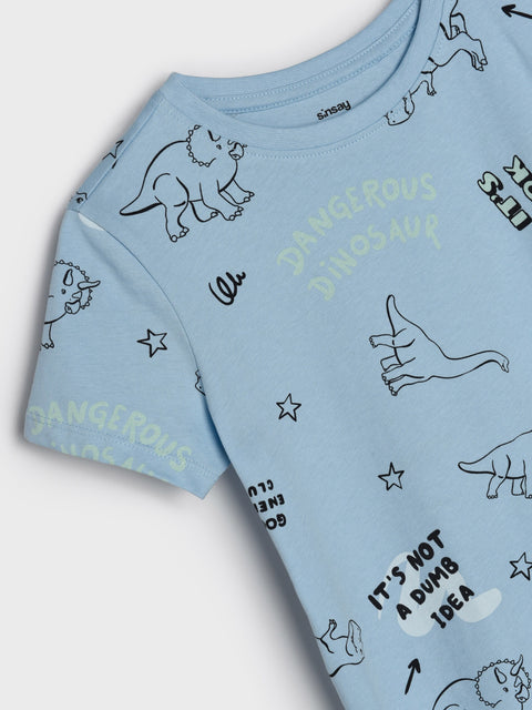Light blue t-shirt with dinosaur prints on a white background