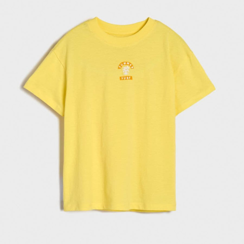 A bright yellow short-sleeve t-shirt with a small orange and white graphic on the left chest, displayed flat against a light gray background.