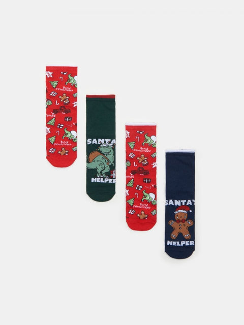 Set of four Christmas-themed socks with cartoon characters on a white background
