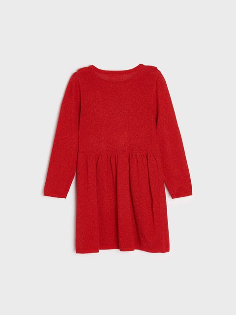 Red dress with long sleeves on a light gray background