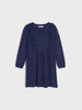Navy blue dress on a light gray background