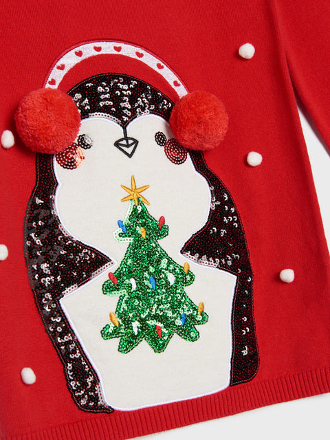 Red dress with a penguin holding a Christmas tree design on a white background