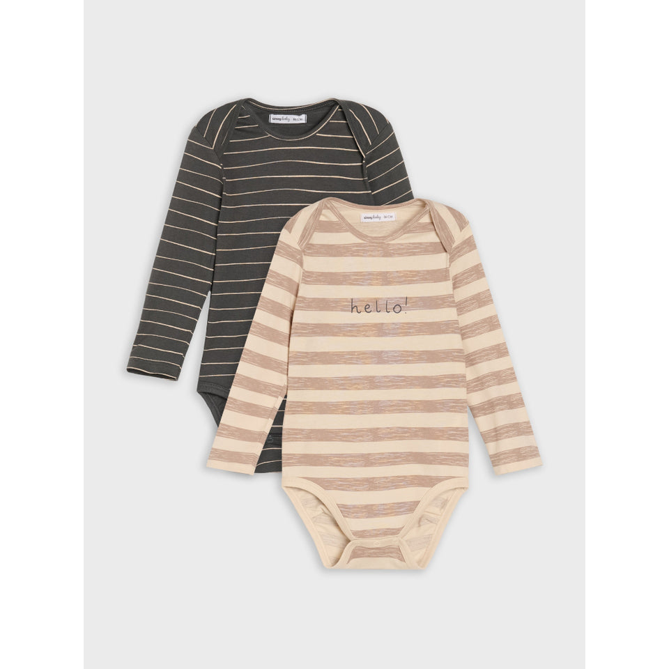 Two long-sleeve baby bodysuits from the brand Maman Naturelle, displayed as a flat lay. The front bodysuit is beige and cream horizontally striped with 'hello!' embroidered on the chest.