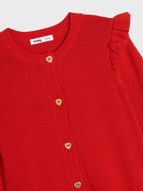 Red sweater with ruffled shoulders on a white background