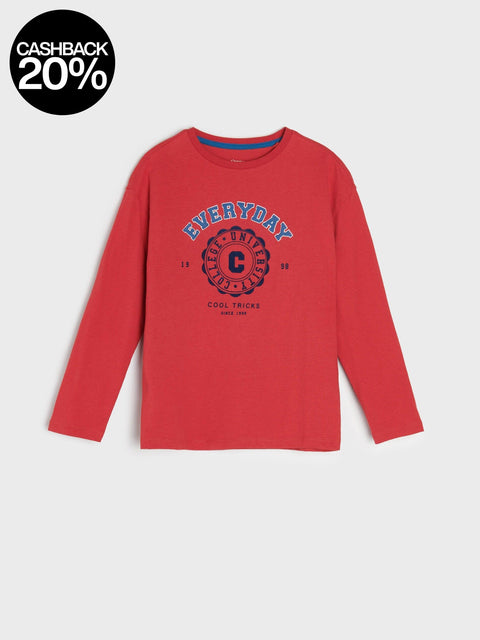 Red long-sleeve shirt with graphic design on a white background