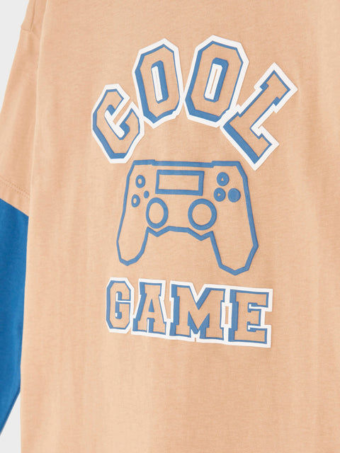 Beige t-shirt with blue gaming controller graphic and 'COOL GAME' text on a white background