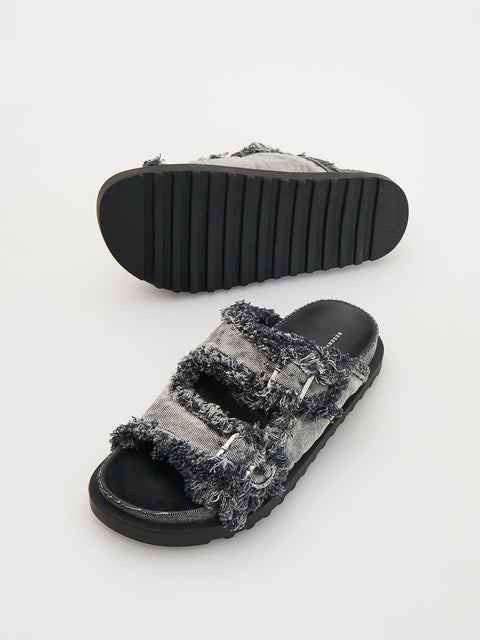 Pair of black sandals with gray textured straps on a white background
