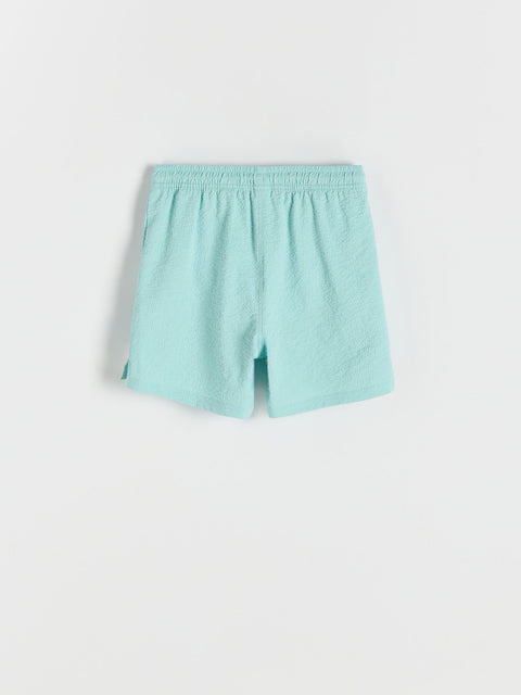 Light blue shorts on a white background