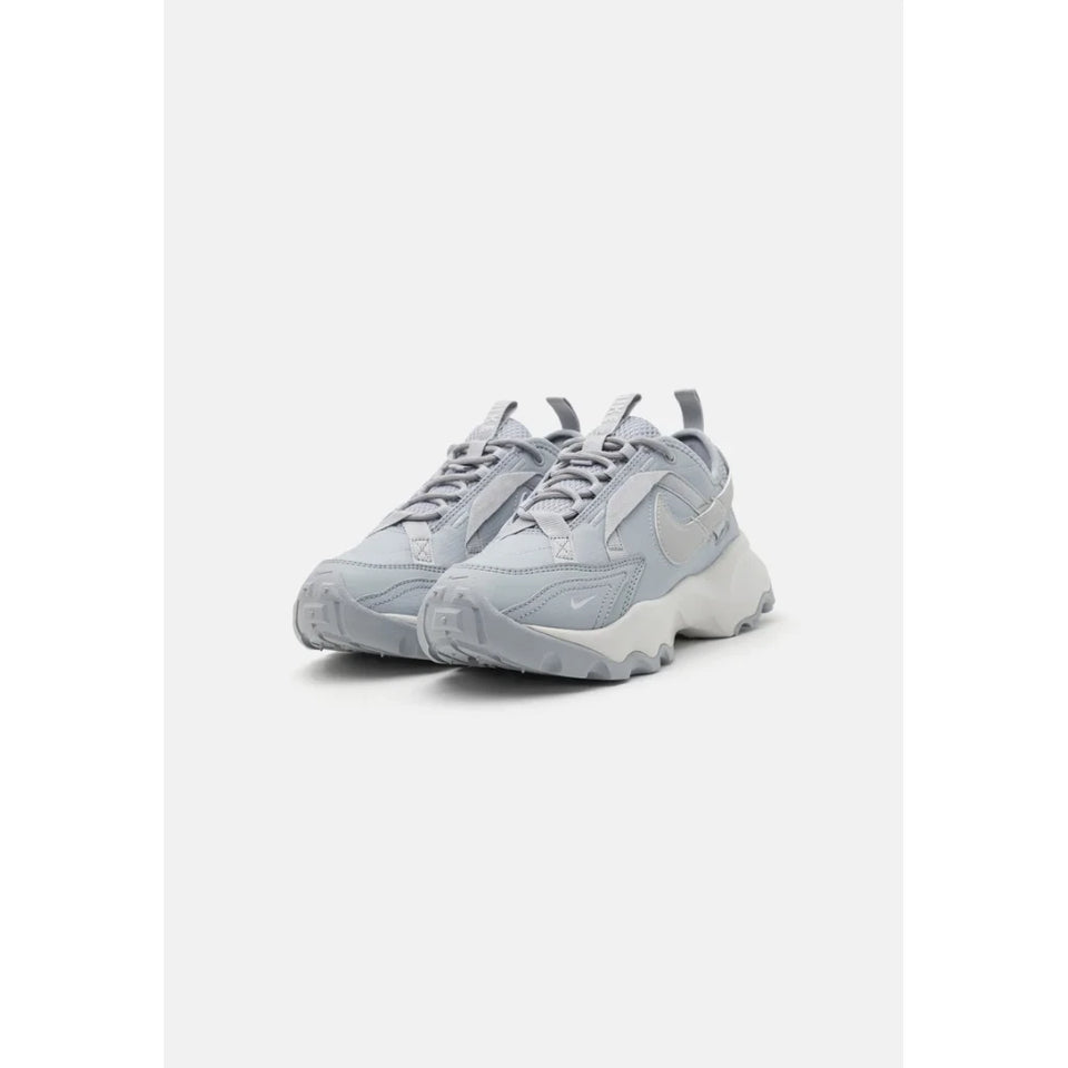 A pair of light gray chunky sneakers with a thick textured sole, shown from a three-quarters angle on a light gray background.