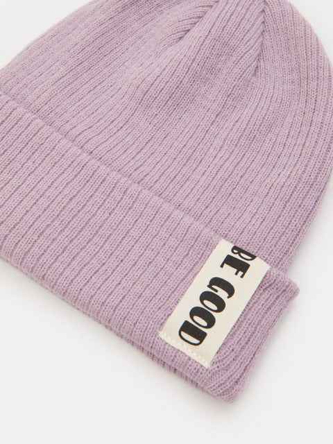 Pink beanie with a label on a white background