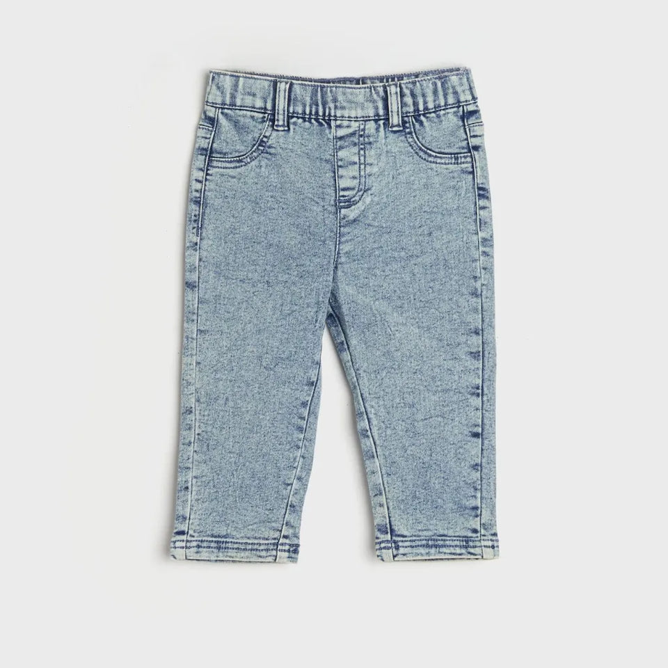 Light blue denim cropped pants for toddlers, featuring an elastic waistband, front pockets, and a straight-leg fit, shown flat on a light gray background.