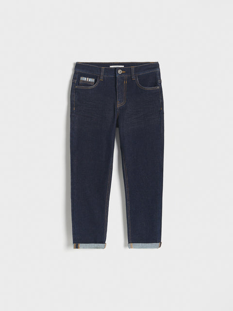 Dark blue jeans on a white background