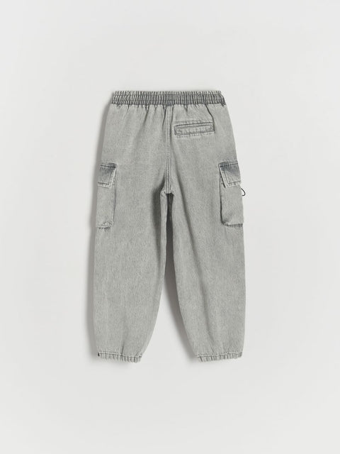 Gray cargo pants on a light gray background
