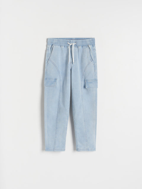 Light blue pants with drawstring on a white background