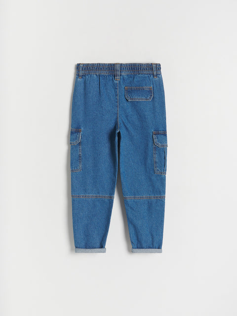 Blue denim pants on a light gray background