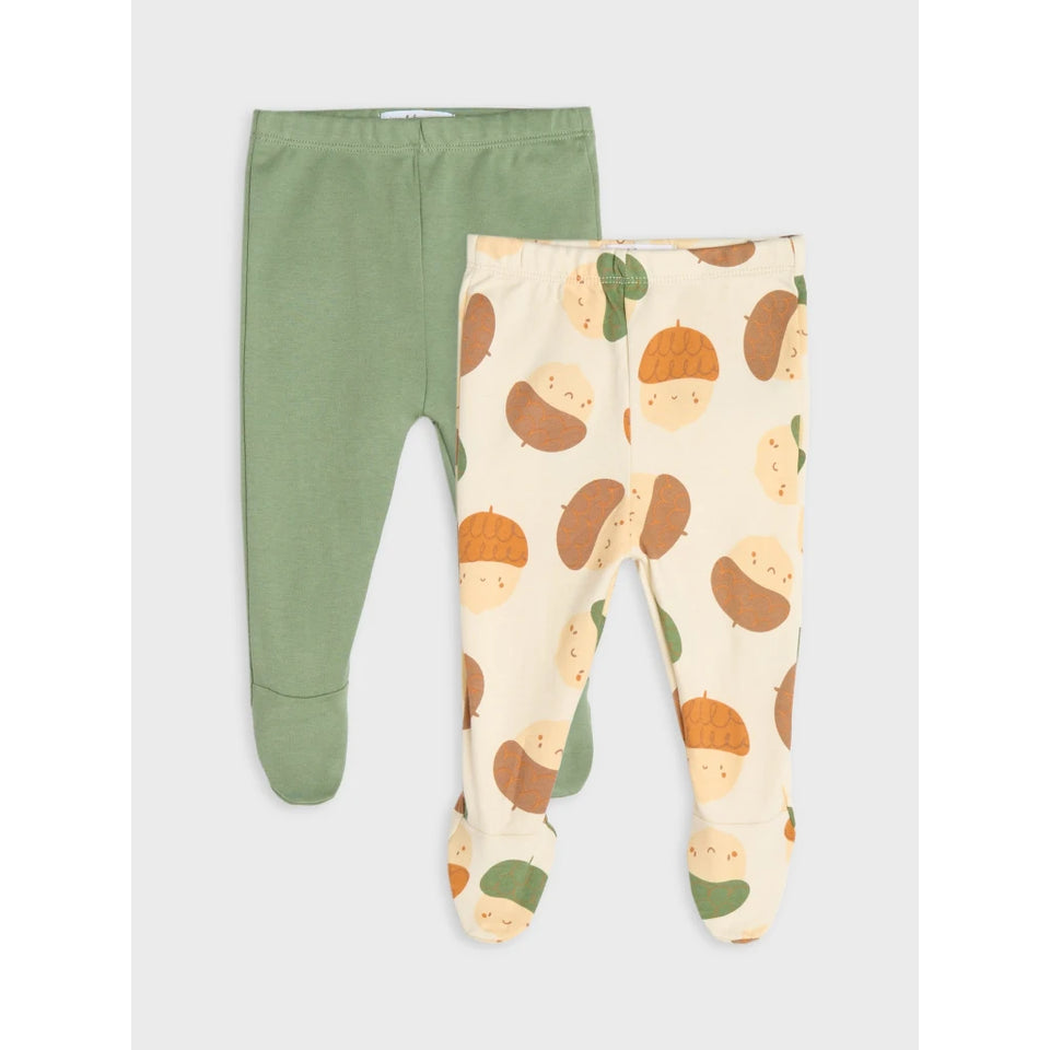 Two pairs of baby footed leggings laid flat on a light gray background. The pair on the left is solid sage green, and the pair on the right has a cream base with a pattern of acorns and leaves in brown, tan, and green.
