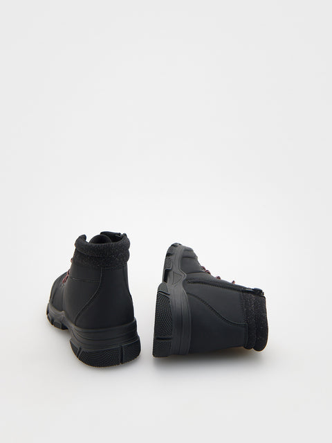 Pair of black boots on a white background