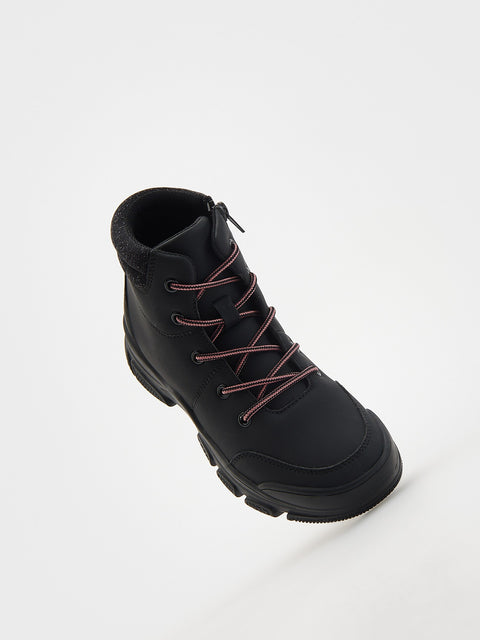 Black boot with red laces on a white background