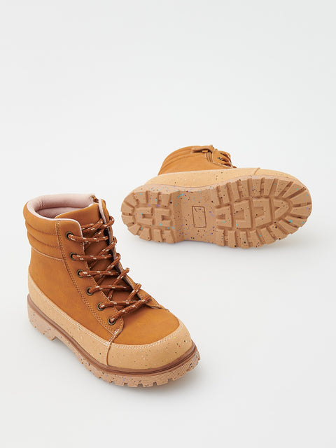 Tan hiking boots with brown laces on a white background