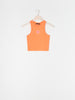 Orange tank top with a pink flower design on a white background