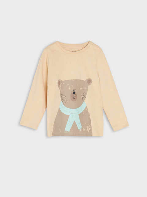 Beige long-sleeve shirt with bear design on a light gray background