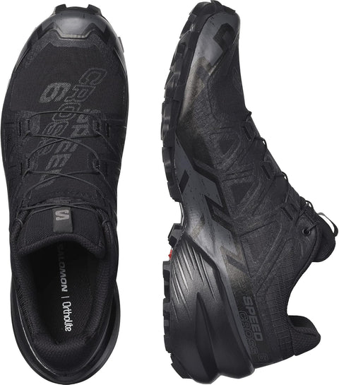 Black running shoes with visible branding on a white background