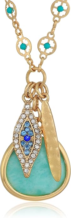 Gold necklace with a turquoise pendant and blue gemstones on a white background