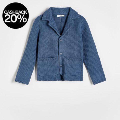 Blue knitted cardigan on a light gray background
