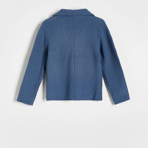 Blue textured jacket on a light gray background