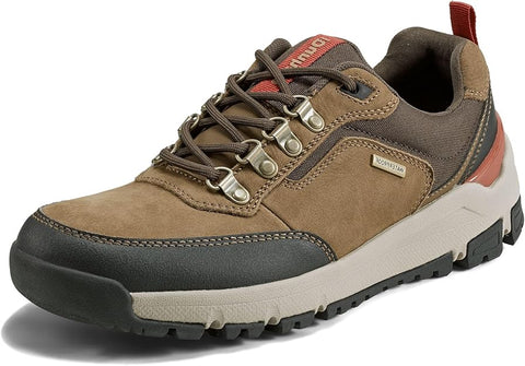 Brown hiking shoe with black sole on a white background
