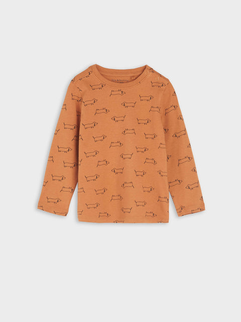 Orange long-sleeve shirt with dog pattern on a white background