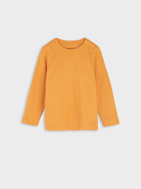 Mustard yellow long-sleeve shirt on a light gray background