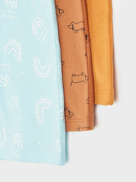 Three pairs of leggings in blue, brown, and yellow on a white background