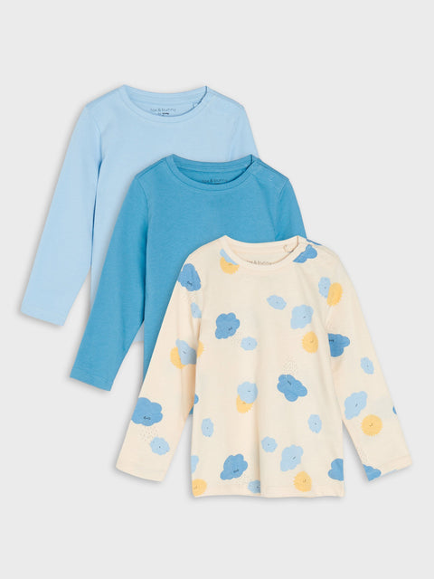 Three children's long-sleeve shirts in blue, light blue, and cream with cloud pattern on a white background