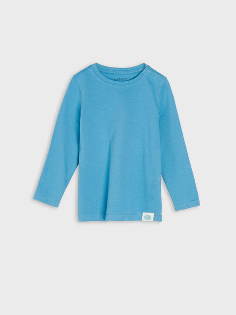 Blue long-sleeve shirt on a light gray background