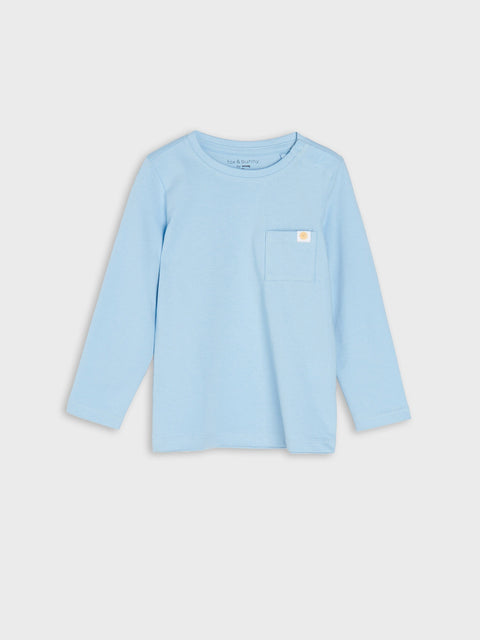 Light blue long-sleeve shirt with a small logo on a light gray background