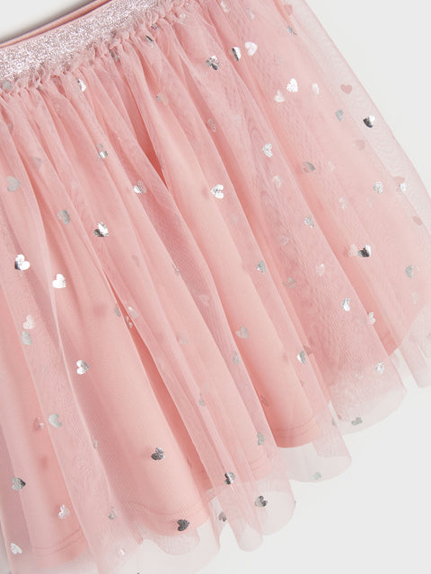 Pink tulle skirt with silver heart sequins on a white background