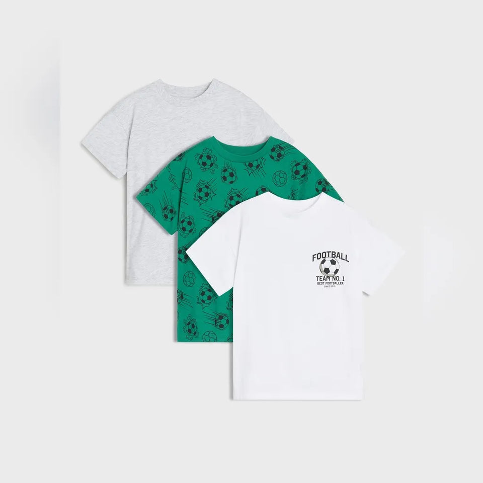 Three children's short-sleeve T-shirts arranged in a fan layout on a light gray background: a heather light gray shirt, a green shirt with a black soccer ball pattern, and a white shirt with a black 'FOOTBALL TEAM NO. 1' graphic on the chest.