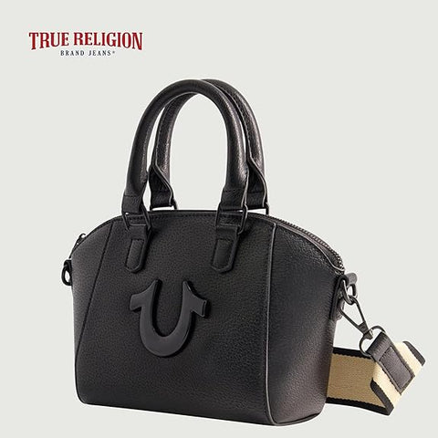 Black handbag with True Religion logo on a light gray background
