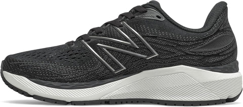 Black running shoe with New Balance logo on a light gray background