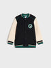 Black and cream varsity jacket with a logo on a light gray background