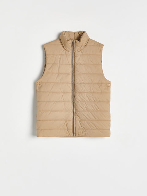 Beige puffer vest on a white background