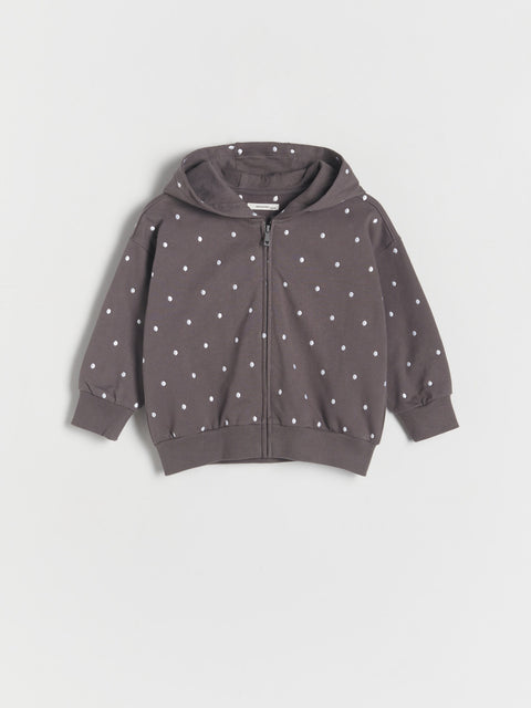 Gray hoodie with white polka dots on a light gray background