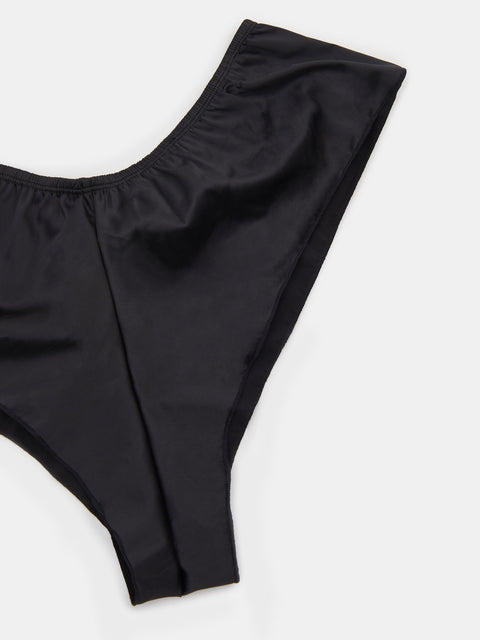 Black swimsuit bottom on a white background