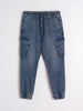 Blue denim jogger pants on a white background