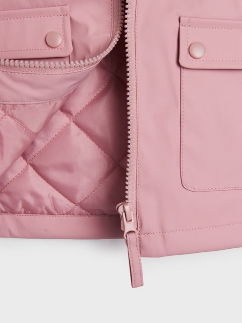 Close-up of a pink quilted jacket with a zipper on a white background