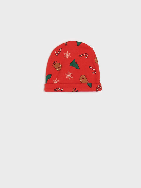 Red beanie with Christmas pattern on a white background