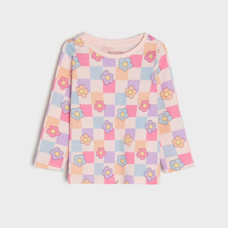 A long-sleeve children's top featuring a pastel checkerboard pattern with colorful flowers, displayed flat against a light gray background.